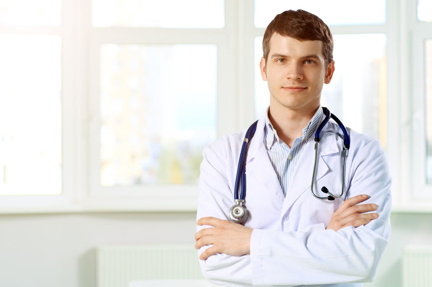A doctor in a white coat with a stethoscope