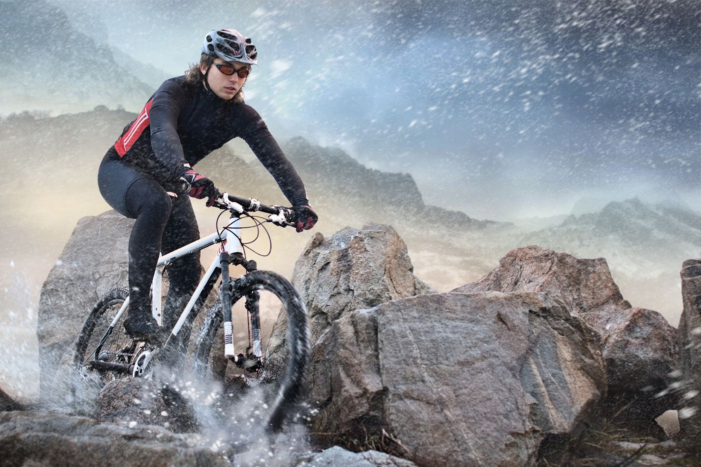 A mountain biker riding over rocks